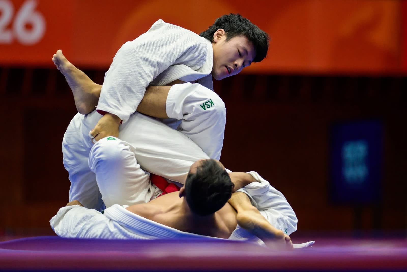 Noah Lim in top position, controlling his opponent on the mat